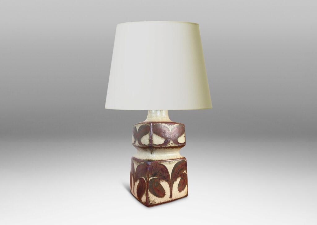 Gallery BAC tiered squared form, glazed in a pale warm gray with foliate motifs in rust luster