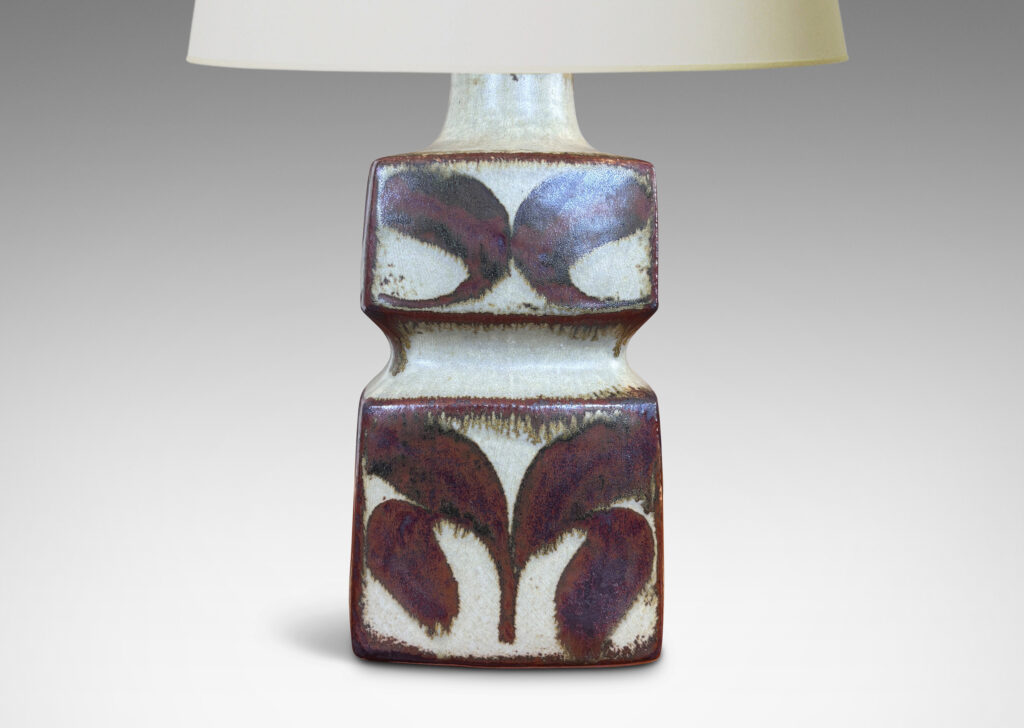 Gallery BAC tiered squared form, glazed in a pale warm gray with foliate motifs in rust luster