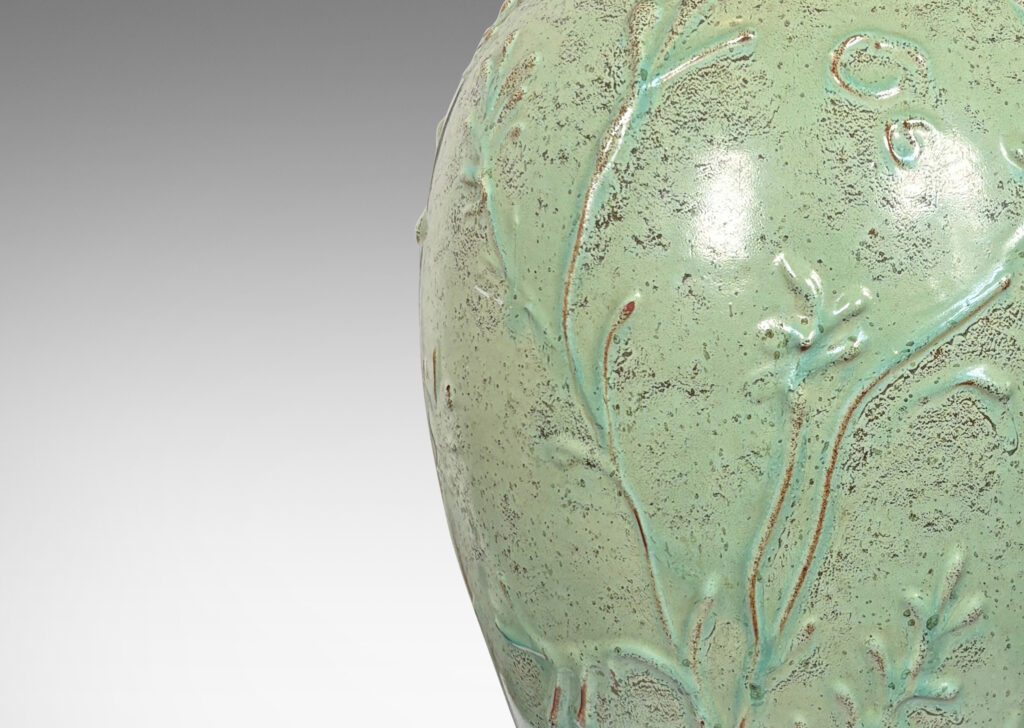 Gallery BAC tapered form with wide neck and abstract foliate reliefs, glazed in a bright celadon