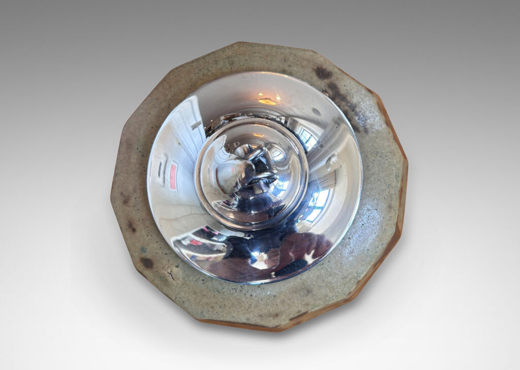 Gallery BAC angled and faceted form glazed in pale taupe-brown, with silver plated lid topped by a foliate finial