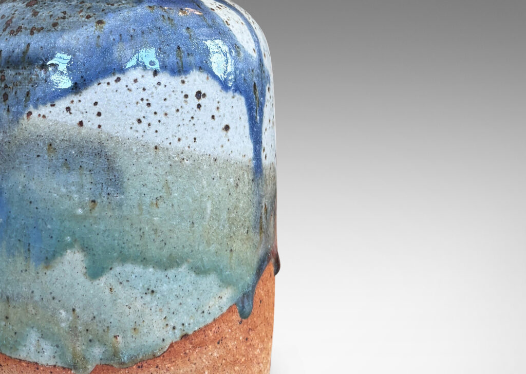 Gallery BAC bottle-like form with layered dusty blue tone glazes textured with metal speckling
