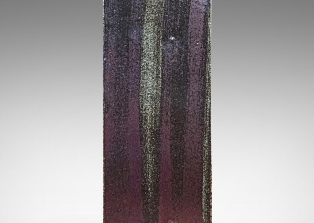 Gallery BAC two floating rectangular planes connected by a central pillar, glazed in dappled gray-brown with brushstroked of black-red luster