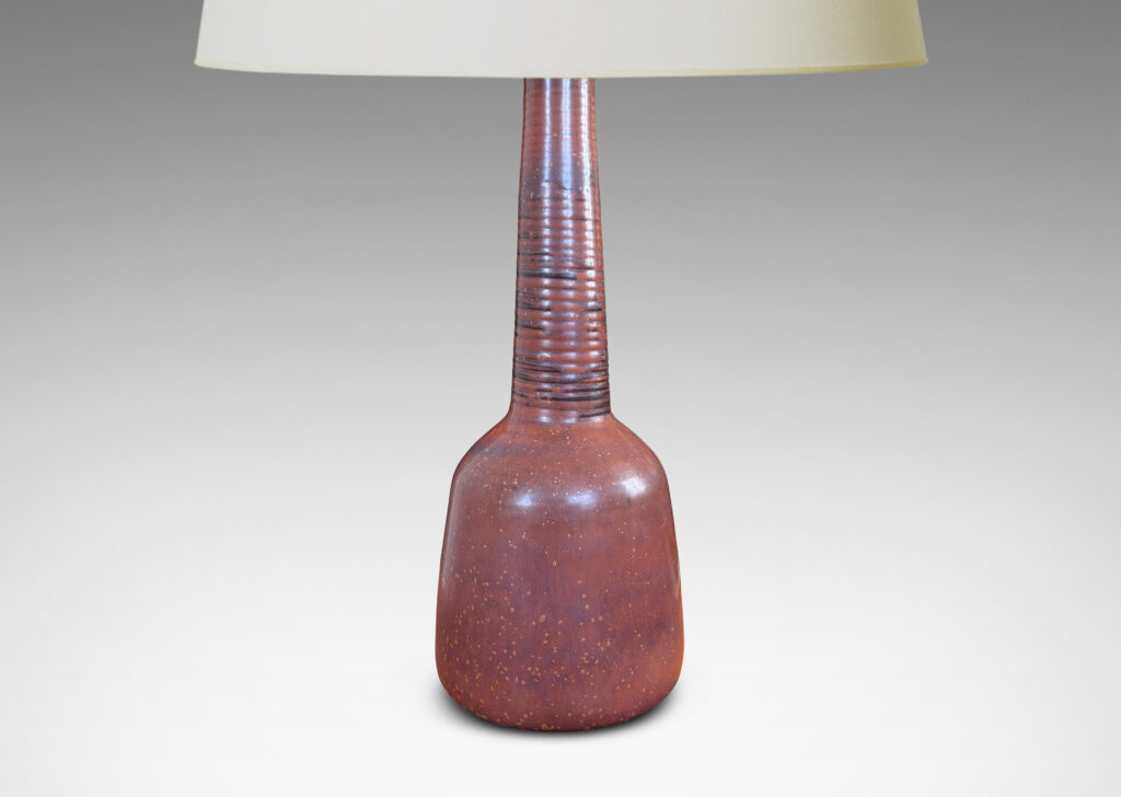 Gallery BAC gumdrop-like three-quarters ovoid form with tall ridged neck, glazed in a rich warm burnt sienna brown