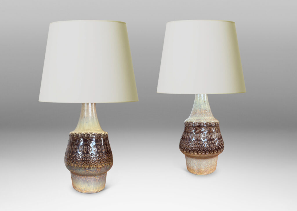 Gallery BAC organically modeled forms with impressed circle and ogival motifs, glazed in tan and deep brown