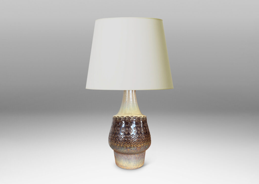Gallery BAC organically modeled forms with impressed circle and ogival motifs, glazed in tan and deep brown