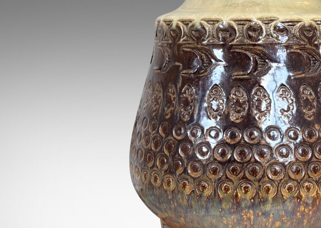 Gallery BAC organically modeled forms with impressed circle and ogival motifs, glazed in tan and deep brown