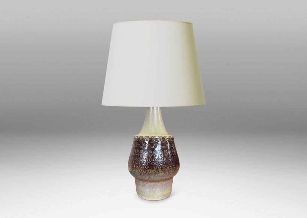 Gallery BAC organically modeled forms with impressed circle and ogival motifs, glazed in tan and deep brown