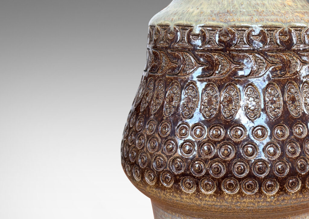 Gallery BAC organically modeled forms with impressed circle and ogival motifs, glazed in tan and deep brown