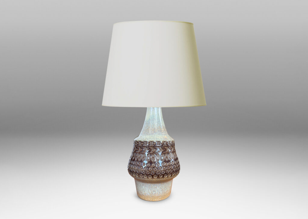 Gallery BAC organically modeled forms with impressed circle and ogival motifs, glazed in tan and deep brown