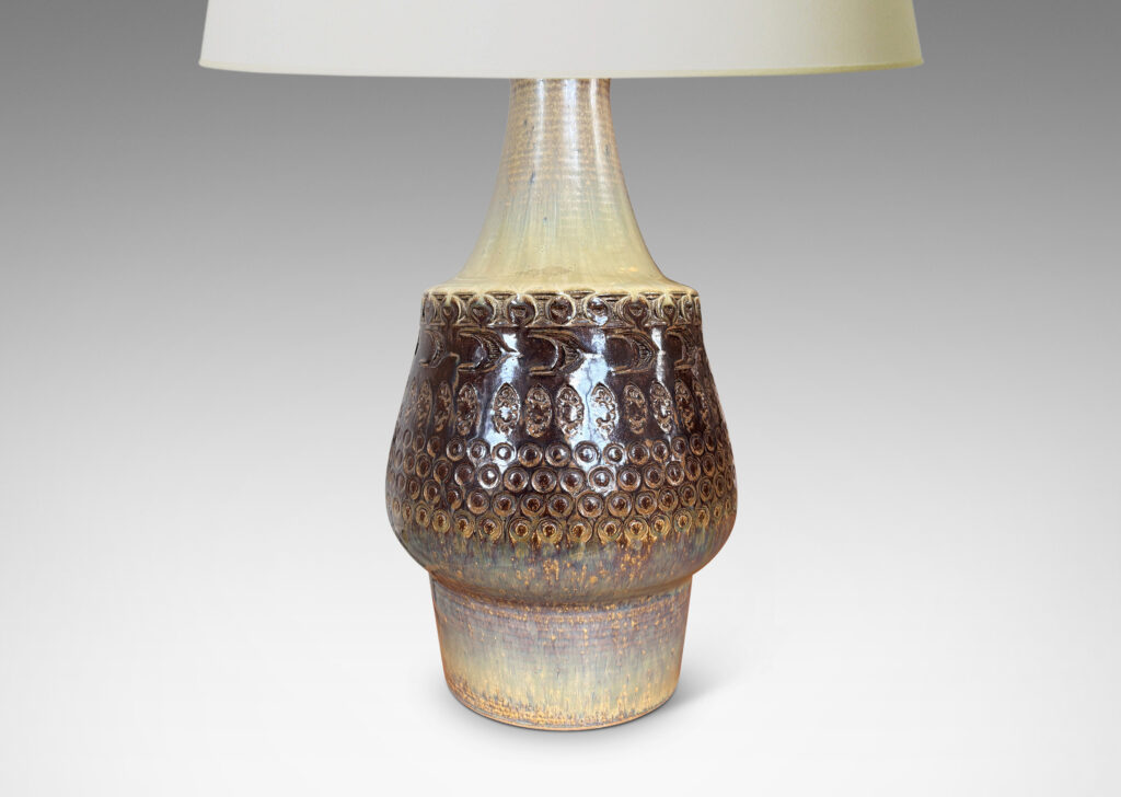 Gallery BAC organically modeled forms with impressed circle and ogival motifs, glazed in tan and deep brown