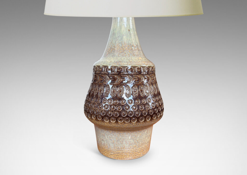 Gallery BAC organically modeled forms with impressed circle and ogival motifs, glazed in tan and deep brown