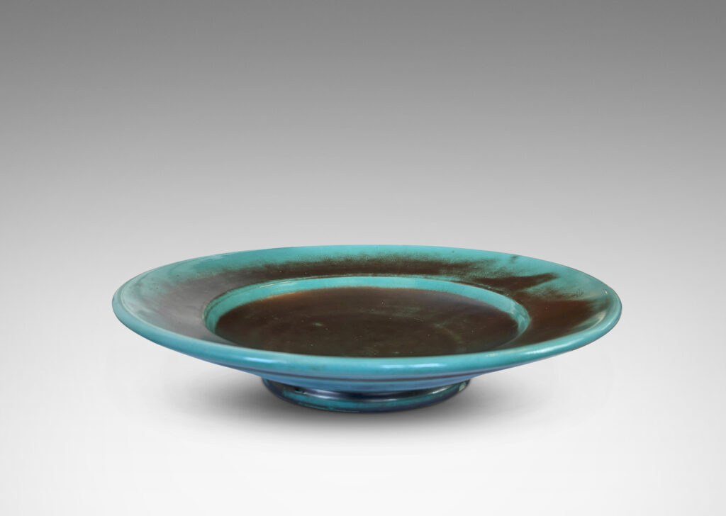 Gallery BAC nverted dome center with wide angled border, glazed in the pottery’s signature cerulean-green and metallic gray-blue