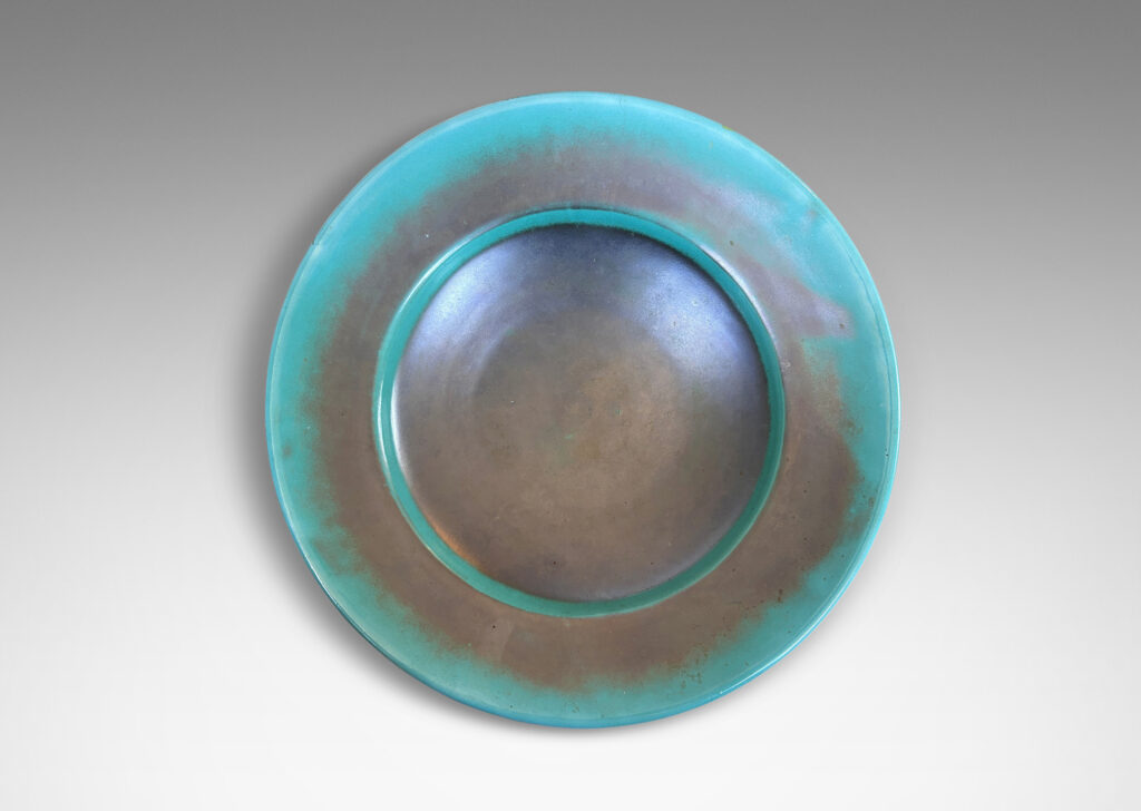 Gallery BAC nverted dome center with wide angled border, glazed in the pottery’s signature cerulean-green and metallic gray-blue