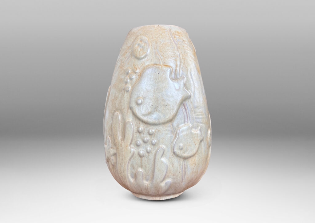 Gallery BACupward tapering ovoid form with playful reliefs of marine flora and fauna, glazed in sandy pale yellow