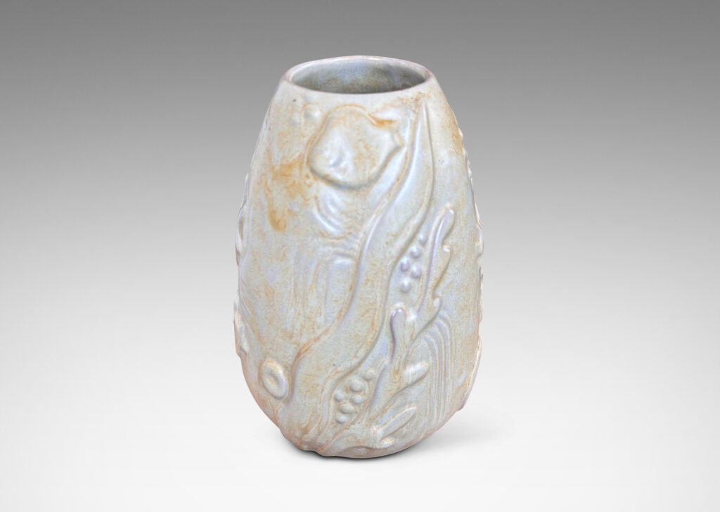 Gallery BACupward tapering ovoid form with playful reliefs of marine flora and fauna, glazed in sandy pale yellow