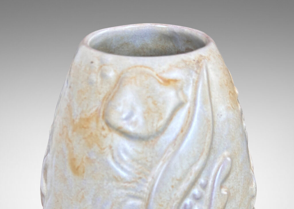 Gallery BACupward tapering ovoid form with playful reliefs of marine flora and fauna, glazed in sandy pale yellow