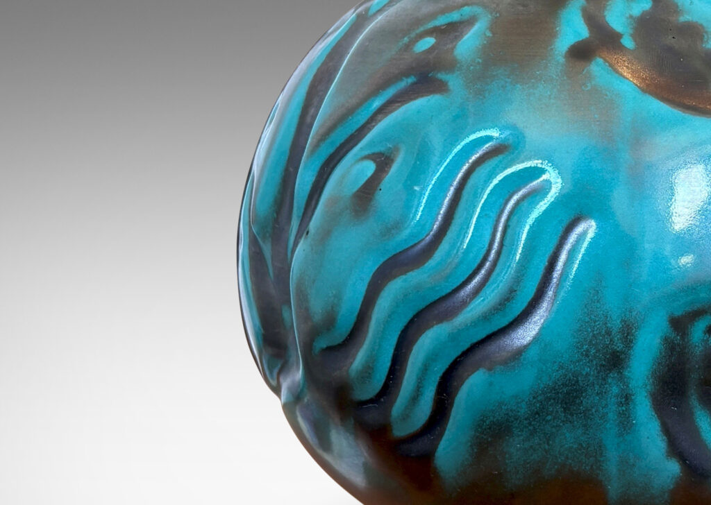 Gallery BAC compressed globe form with fish and water floral in bas relief, in a tonal blue-green copper oxide