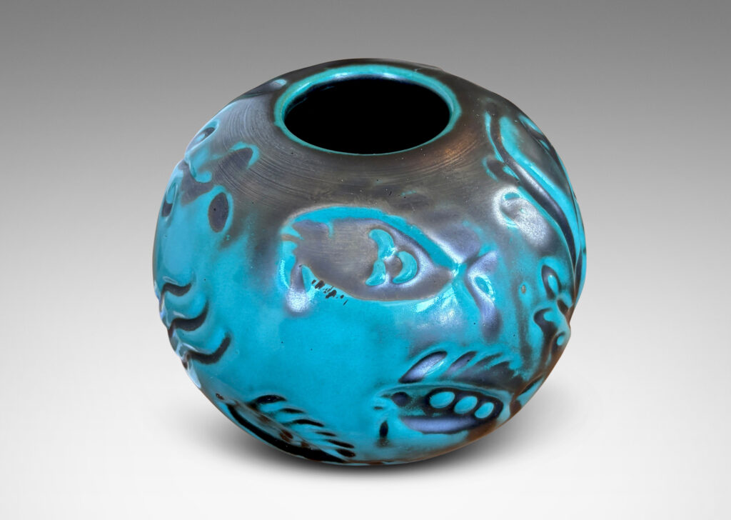 Gallery BAC compressed globe form with fish and water floral in bas relief, in a tonal blue-green copper oxide