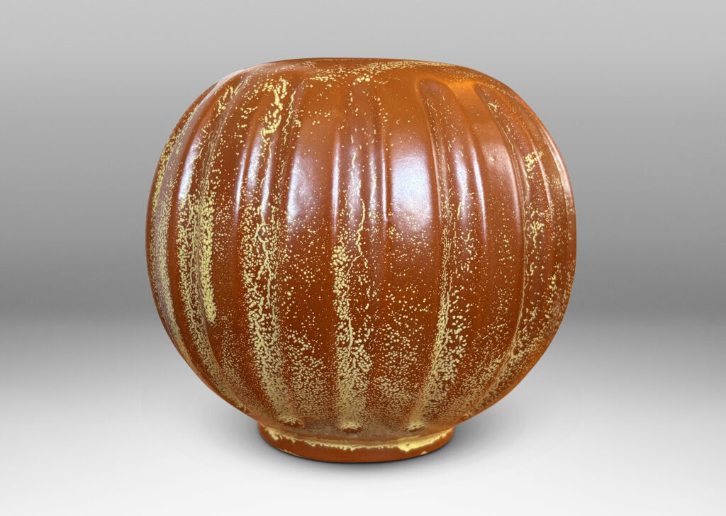 Gallery BAC lobed pumpkin-like form with wide mouth, glazed in tobacco brown with yellow stippling