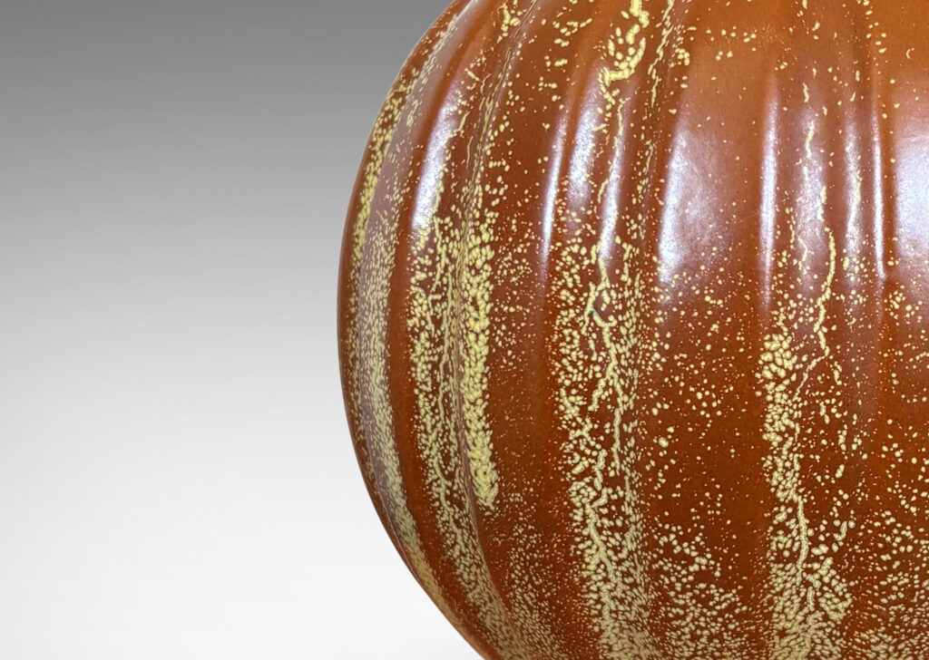 Gallery BAC lobed pumpkin-like form with wide mouth, glazed in tobacco brown with yellow stippling