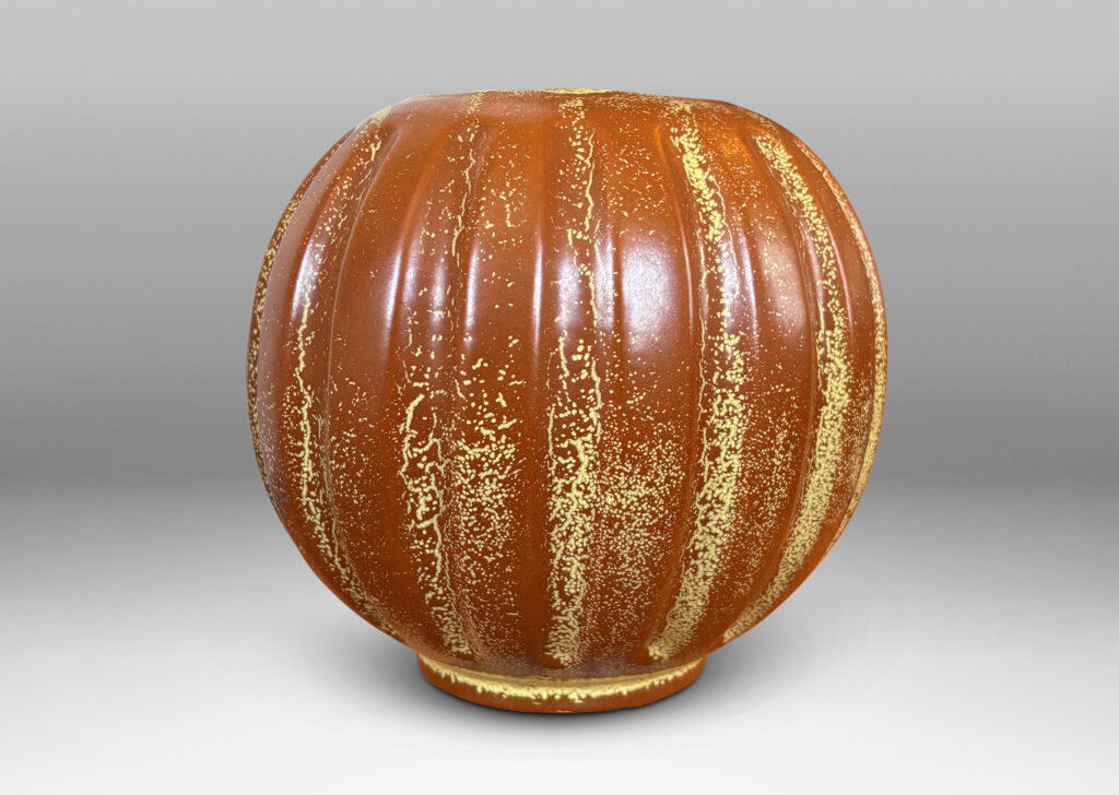 Gallery BAC lobed pumpkin-like form with wide mouth, glazed in tobacco brown with yellow stippling