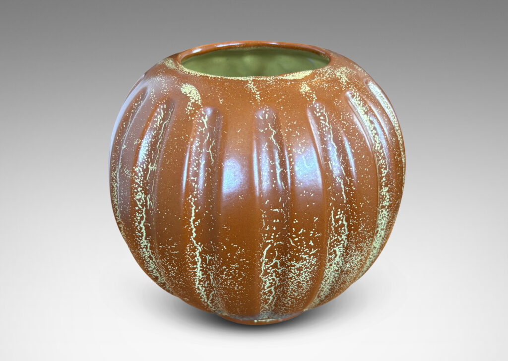 Gallery BAC lobed pumpkin-like form with wide mouth, glazed in tobacco brown with yellow stippling