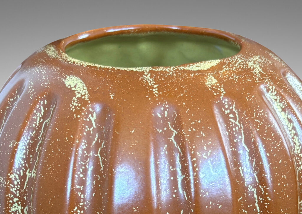 Gallery BAC lobed pumpkin-like form with wide mouth, glazed in tobacco brown with yellow stippling
