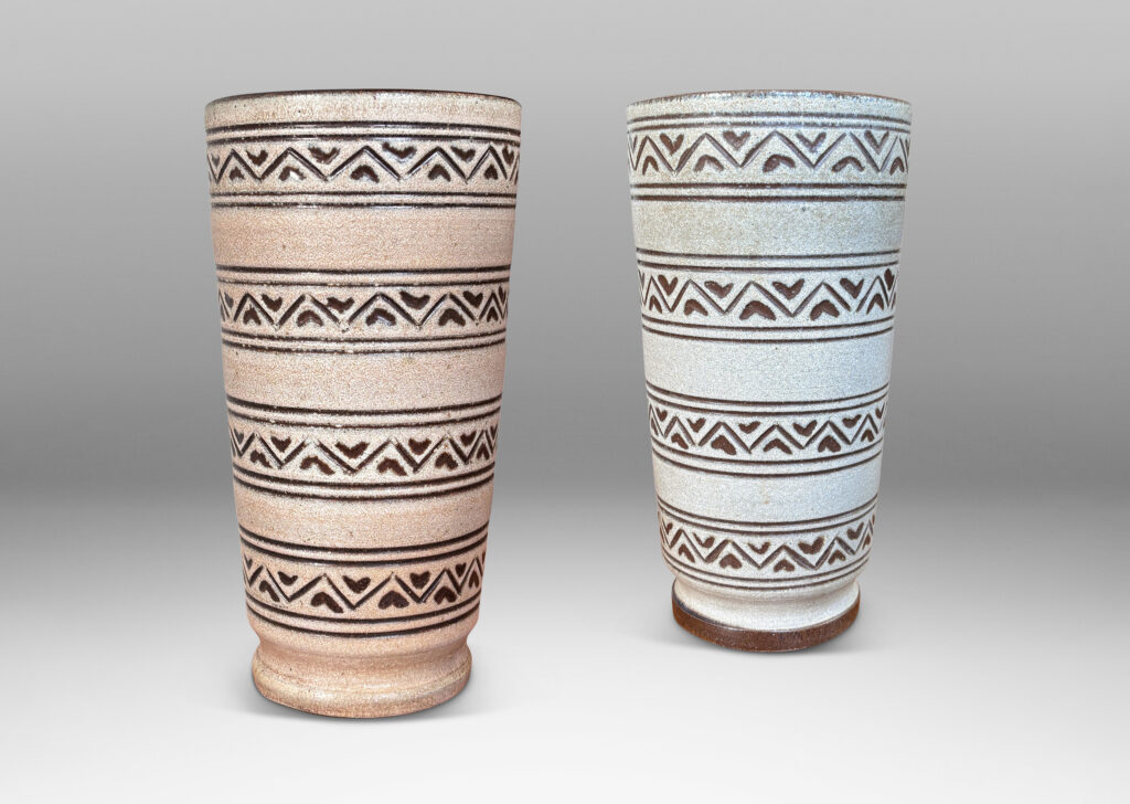 Gallery BAC tall tapered cylindrical forms, with carved pinstripes and zigzag bands, partially glazed brown ornaments and interior