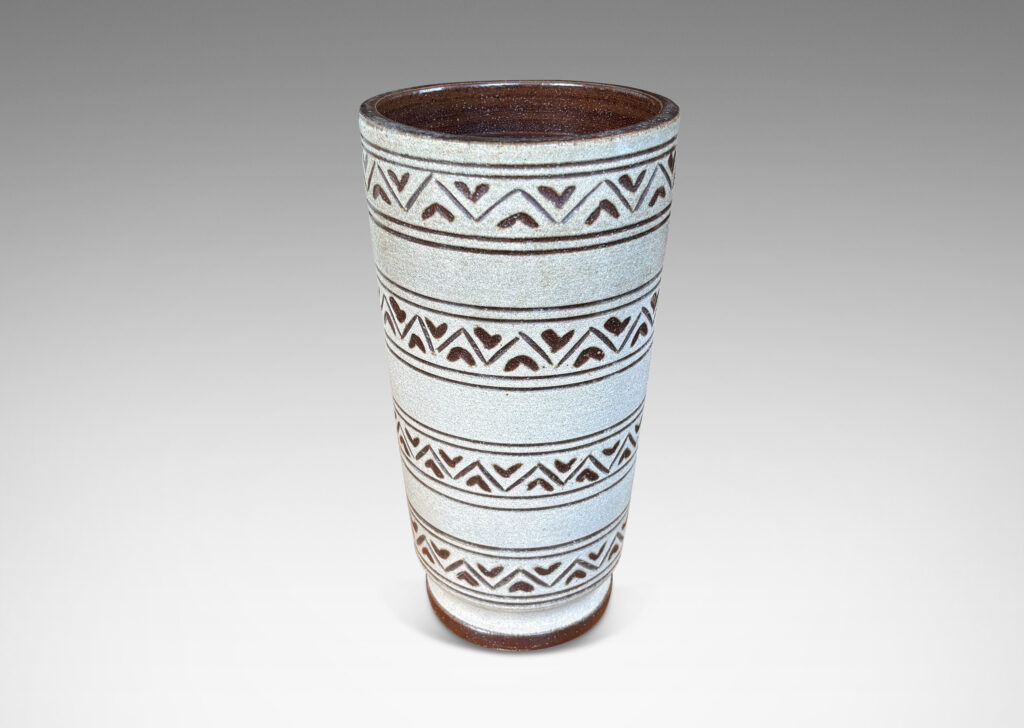 Gallery BAC tall tapered cylindrical forms, with carved pinstripes and zigzag bands, partially glazed brown ornaments and interior