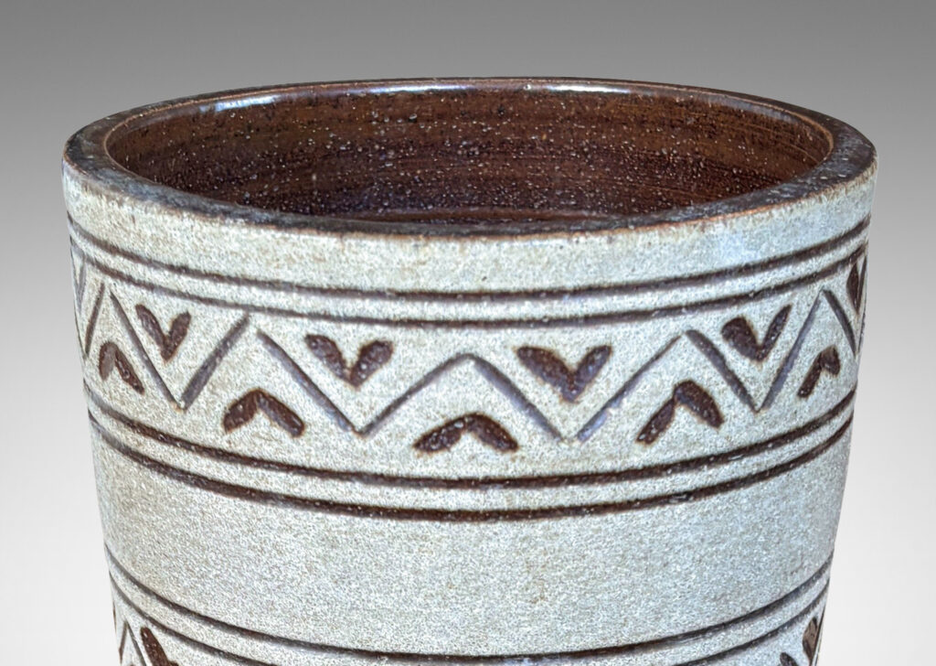 Gallery BAC tall tapered cylindrical forms, with carved pinstripes and zigzag bands, partially glazed brown ornaments and interior