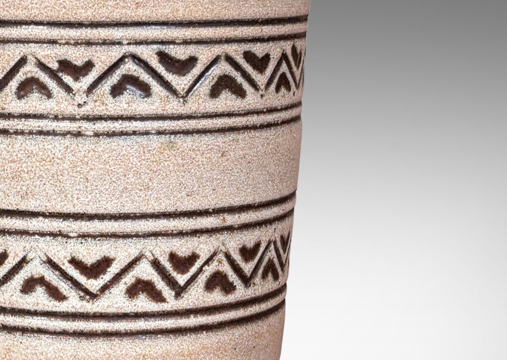 Gallery BAC tall tapered cylindrical forms, with carved pinstripes and zigzag bands, partially glazed brown ornaments and interior