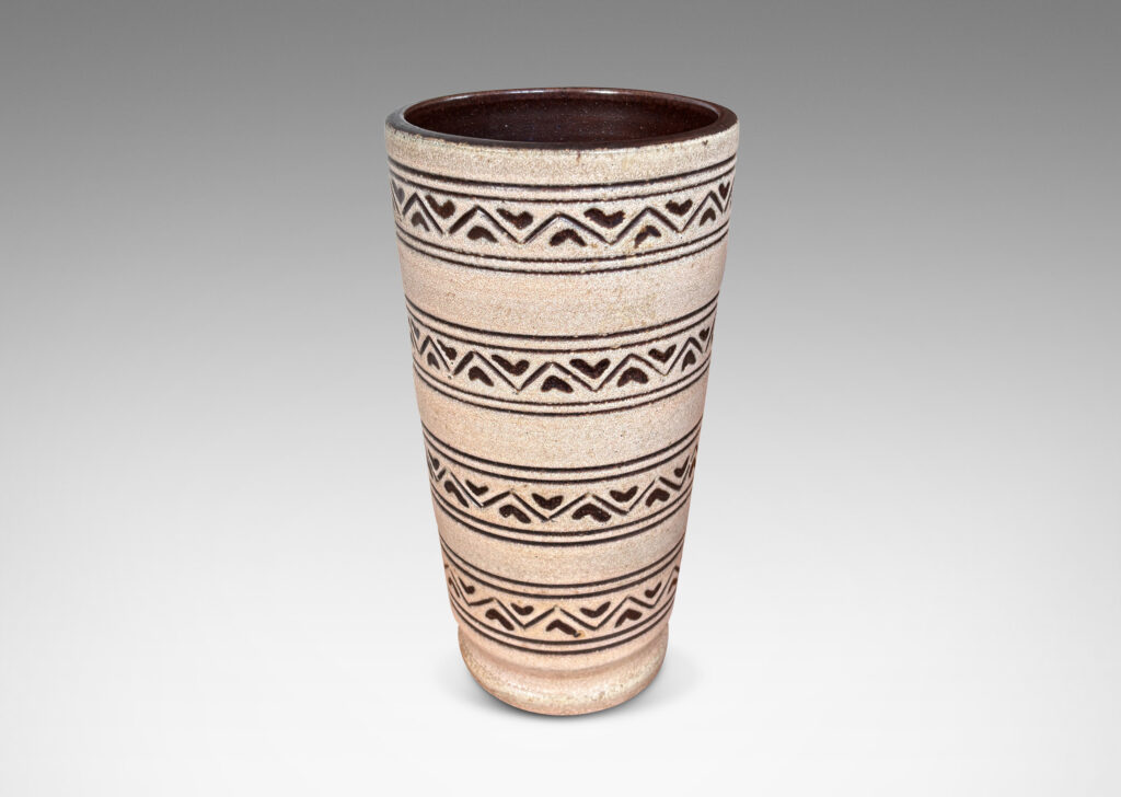 Gallery BAC tall tapered cylindrical forms, with carved pinstripes and zigzag bands, partially glazed brown ornaments and interior