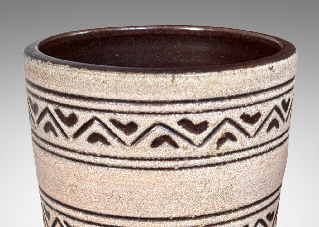 Gallery BAC tall tapered cylindrical forms, with carved pinstripes and zigzag bands, partially glazed brown ornaments and interior