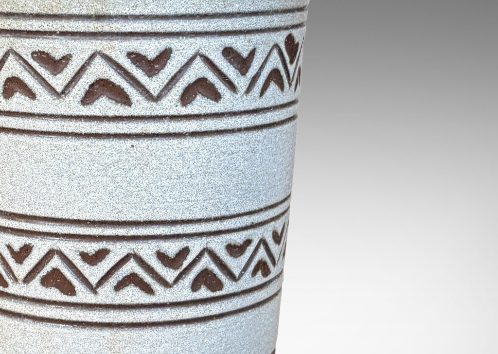 Gallery BAC tall tapered cylindrical forms, with carved pinstripes and zigzag bands, partially glazed brown ornaments and interior