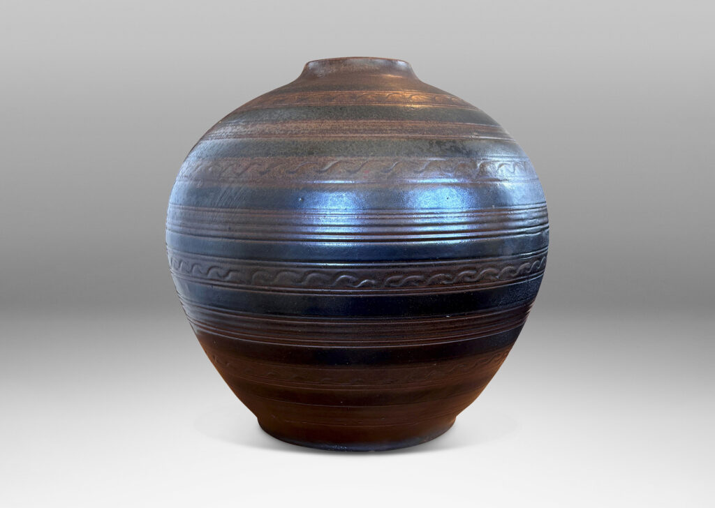 Gallery BAC tapered globe form with carved horizontal registers of alternating patterns, glazed in deep brown-black