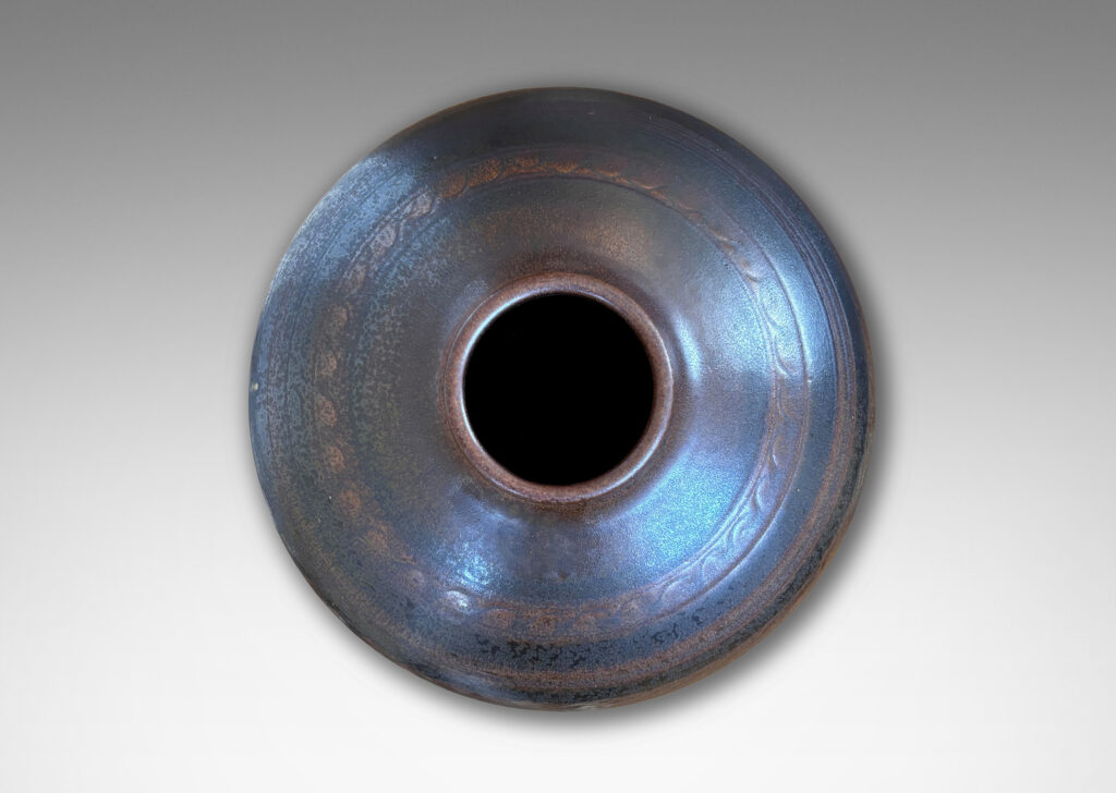 Gallery BAC tapered globe form with carved horizontal registers of alternating patterns, glazed in deep brown-black