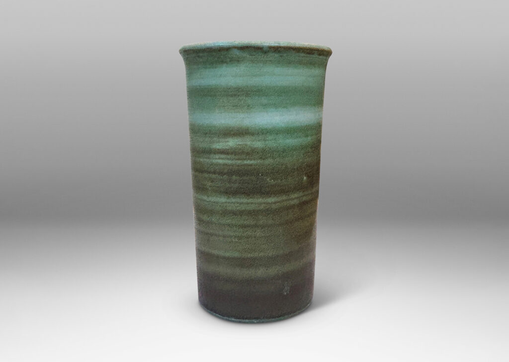 Gallery BAC cylindrical form with gently flared lip, striae glazed in evergreen and jade green tones, with a pale gray interior