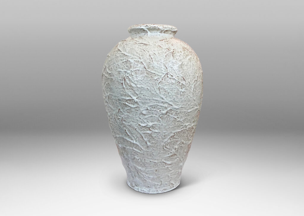 Gallery BAC tapered form with lively rustic texture, glazed in a very pale gray with hints of brown