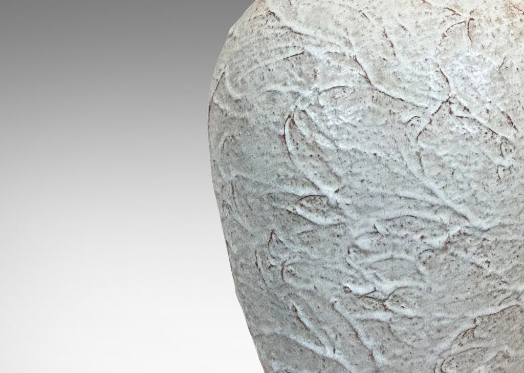 Gallery BAC tapered form with lively rustic texture, glazed in a very pale gray with hints of brown