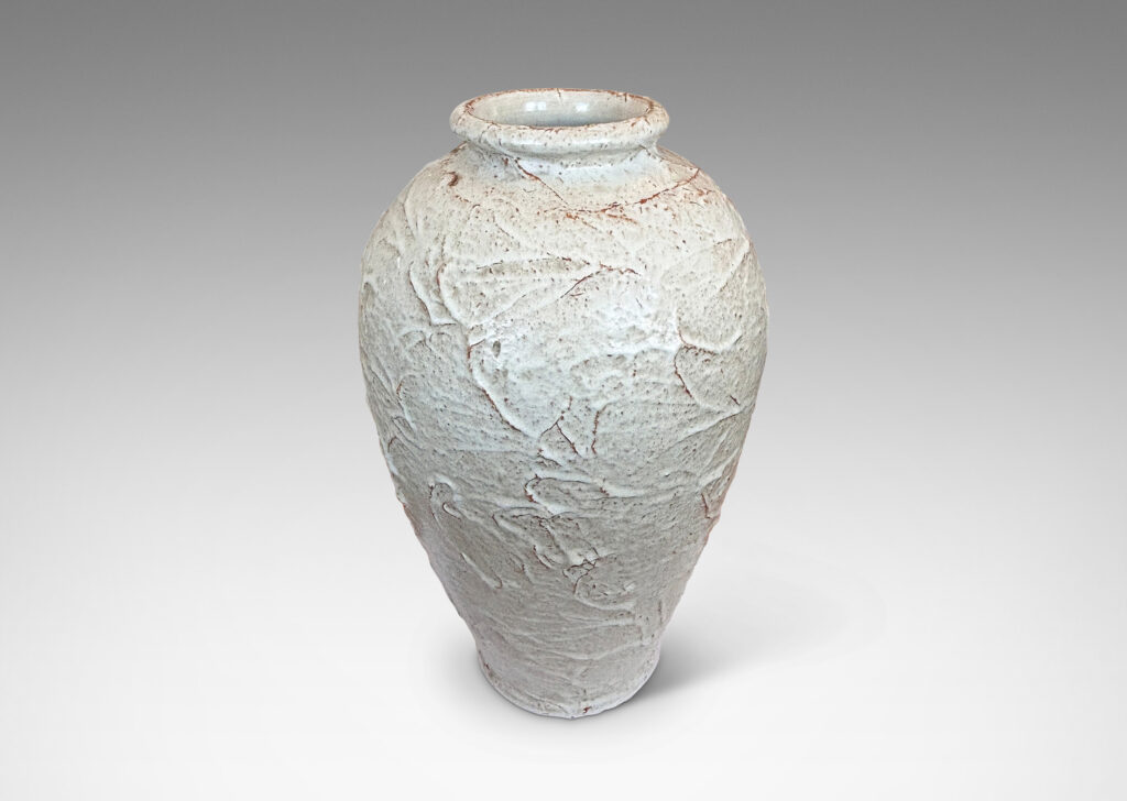 Gallery BAC tapered form with lively rustic texture, glazed in a very pale gray with hints of brown