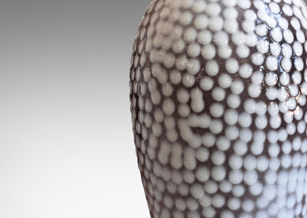Gallery BAC tapered ovoid forms in gray glaze with applied white polka dots