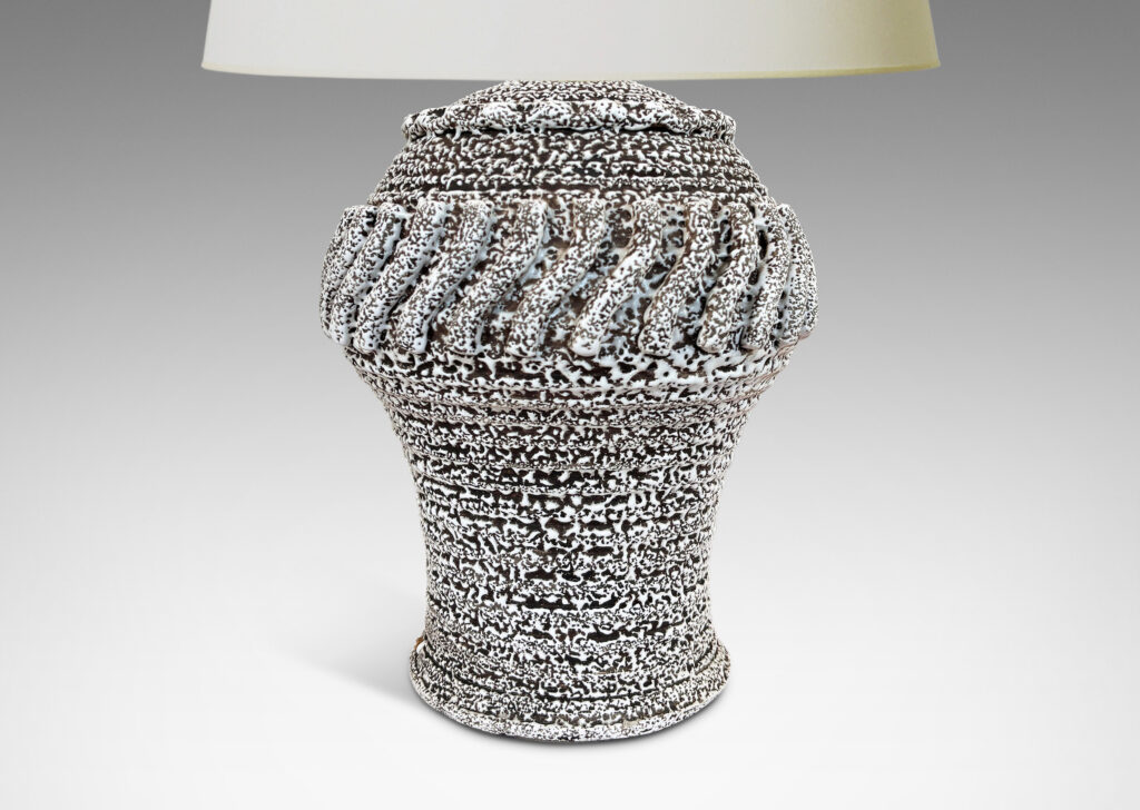 Gallery BAC arge ridged ballooning form, with relief “piecrust” band and circle of applied S-forms, glazed in a white “crispé” layer over matte brown