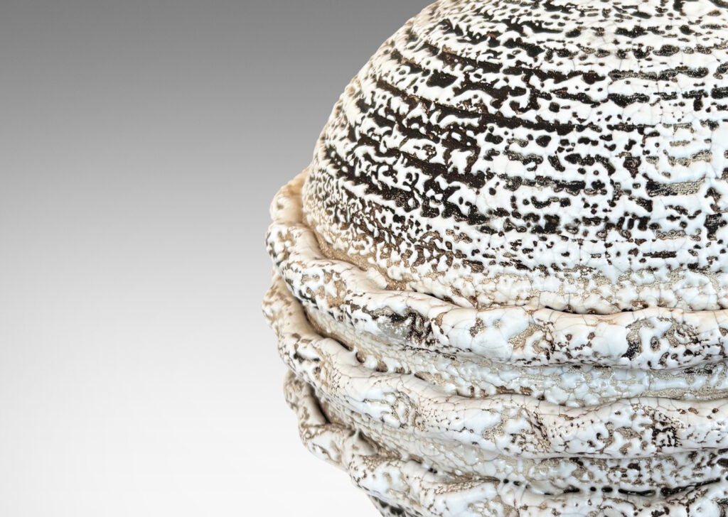 Gallery BAC globe form with applied piecrust style banding, glazed in a white “crispé” layer over matte brown