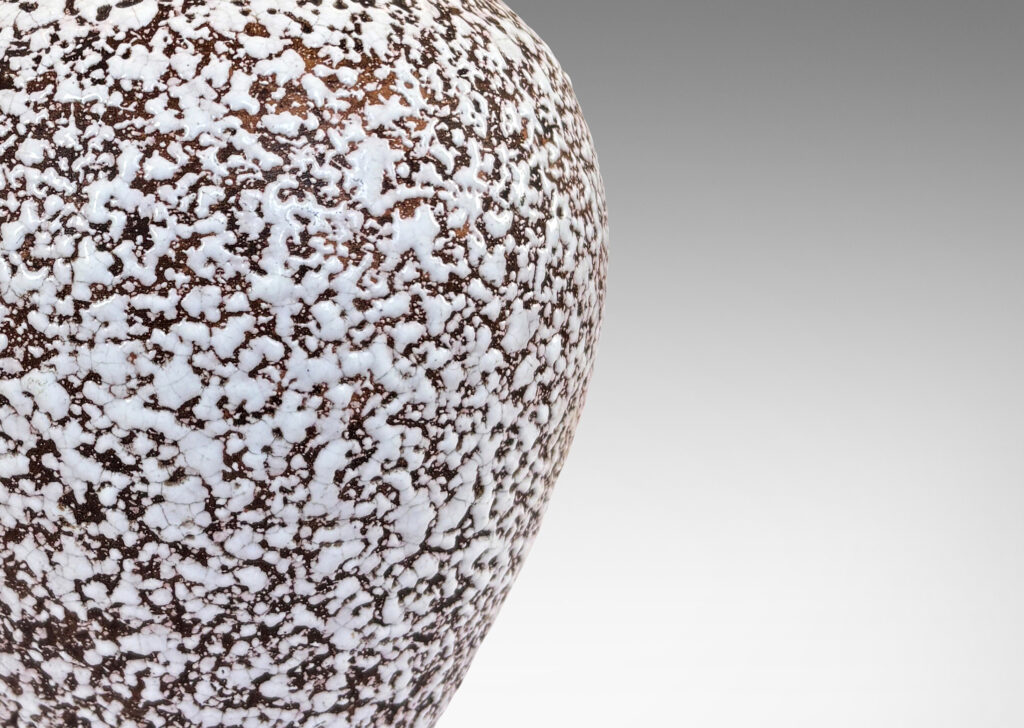 Gallery BAC tapered ovoid form with flanged base, glazed in a white “crispé” layer over matte brown