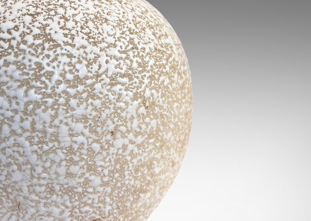 Gallery BAC tapered globe form, glazed in a white “crispé” layer over matte ivory
