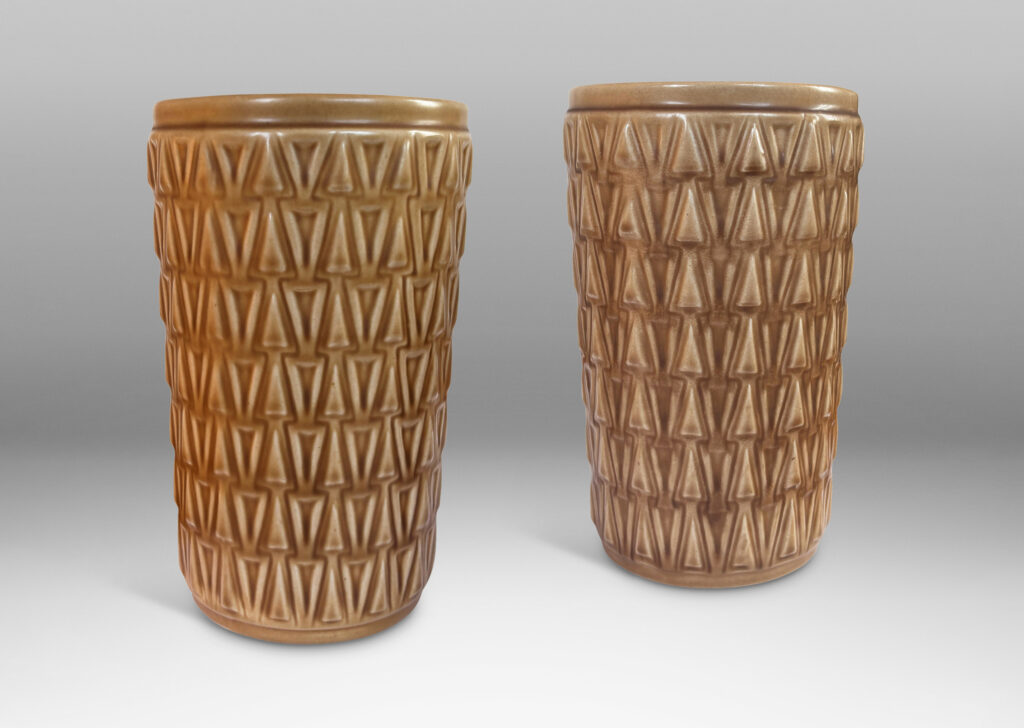 Gallery BAC tapered cylindrical forms patterned with rows of relief triangles, glazed tan