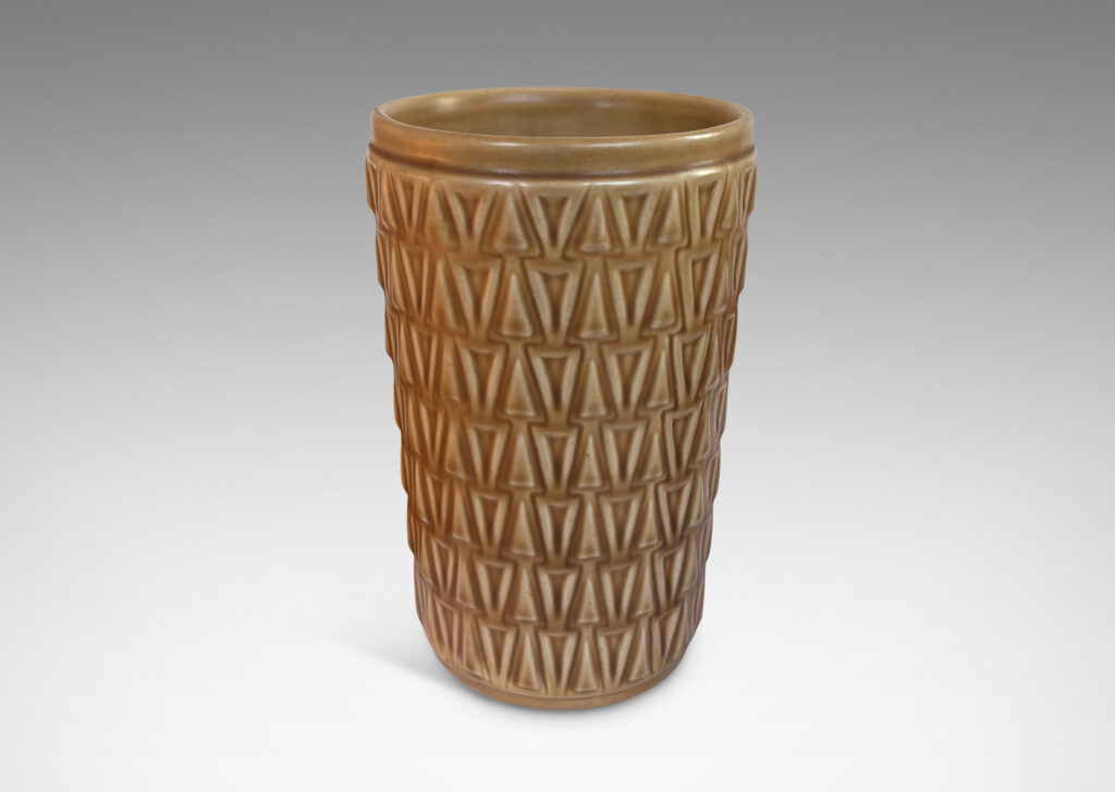 Gallery BAC tapered cylindrical forms patterned with rows of relief triangles, glazed tan