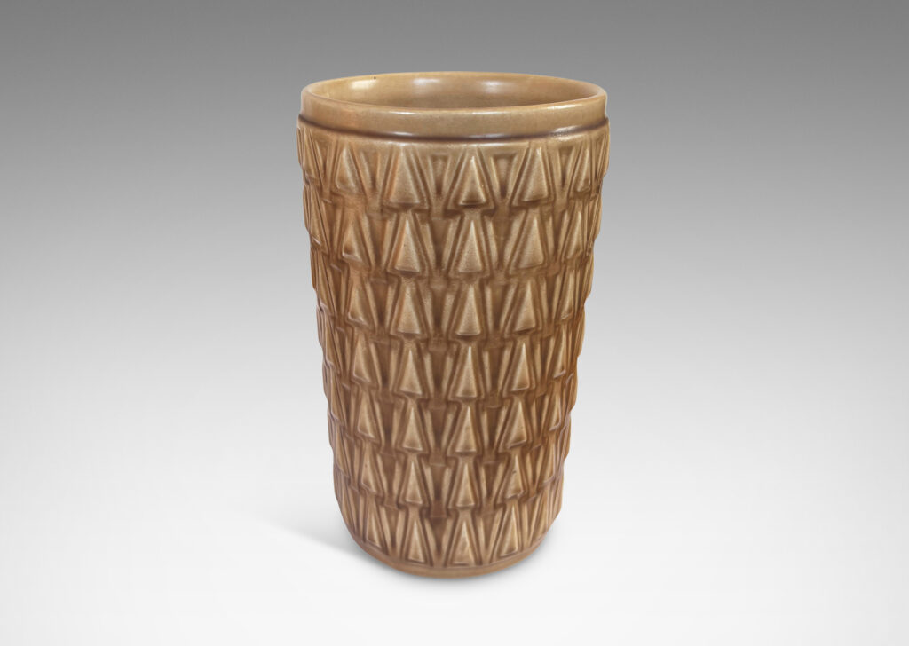 Gallery BAC tapered cylindrical forms patterned with rows of relief triangles, glazed tan
