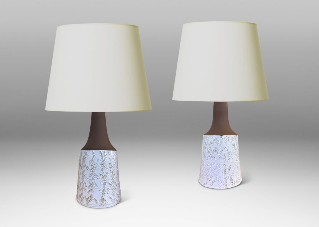 Gallery BAC slant-sided cylindrical forms with impressed texture and sprouting necks, glazed in shiny white and matte brown