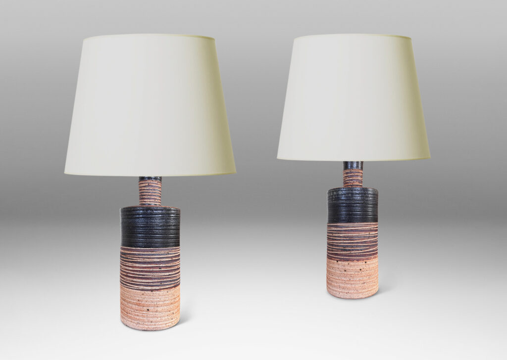 Gallery BAC slant-sided cylindrical forms with impressed texture and sprouting necks, glazed in shiny white and matte brown